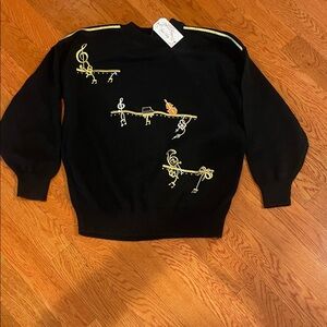 Elegant Black Crewneck Sweater with Gold‎ Music Accents